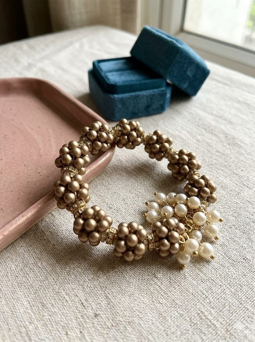 Golden Pearl Rakhi with White Pearl Drops